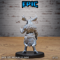Moose-headed tribal warrior seen from behind, revealing a dense feather cloak across the shoulders and back, thick rope waist bindings, and a decorated hide kilt with carved detailing. Broad antlers visible above. Sculpt by Epic Miniatures.