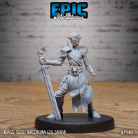 Undead elf fighter miniature facing forward, longsword tip planted on the ground, eyes wrapped in cloth bindings, wearing split-hem robes, shoulder armour, and a skull-clasped belt. Sculpt by Epic Miniatures.
