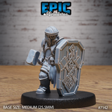 Undead dwarf fighter clutching a square-headed warhammer, braced behind a large heater shield engraved with geometric dwarven runes, wearing full plate armour with a skull belt clasp. Sculpt by Epic Miniatures.