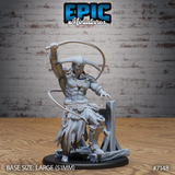 Broad, bare-chested masked giant raising a long whip overhead in a wide arc, wearing tattered rope-belted robes and a horned mask, standing on a wooden scaffold scenic base. Sculpt by Epic Miniatures.