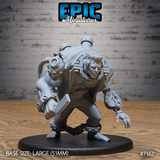 Massive hunched humanoid with mechanical arms, bolted chest plates, gear fittings, and a pressure canister on its back, leaning forward aggressively with spiked ankle shackles. Sculpt by Epic Miniatures.