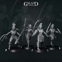 Four unpainted grey resin Amazon warrior miniatures by Galaad Miniatures on round black bases — from left: a warrior with coiled rope and hatchet, a spear-bearer with quiver mid-stride, a sword-and-shield fighter stepping forward, and a dual-blade runner in motion. All wear feathered headwear and tribal wrappings. 32mm scale.