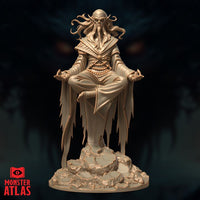 Front view of an unpainted resin Githzerai Zerth miniature by Monster Atlas — a gaunt, bald, long-eared humanoid levitating cross-legged in meditation, wearing flowing robes with frayed hems, prayer beads at the waist, tentacle-like hair drifting behind the head, hands in open gesture, mounted on a rocky scenic base