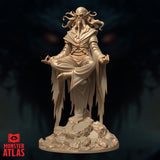 Three-quarter front view of the Monster Atlas Githzerai Zerth resin miniature — showing the full levitating seated pose, layered robes, beaded sash, elongated skull, and detailed rocky base from a slightly raised angle