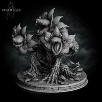 Side-angle digital render of the Hydra Bloom miniature — upright lunging pose with one raised toothed flower-head reaching forward and a second open maw visible at centre, root and vine body texture clearly detailed, unpainted grey resin