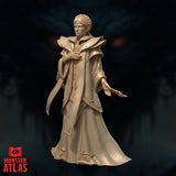 32mm unpainted resin miniature of a noble female figure with a close-pinned braid and a composed downward hand gesture, wearing full-length robes with arcane hem detailing and layered collar armour — Variation 03 by Monster Atlas