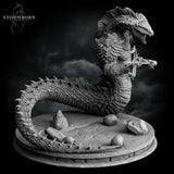 Digital render of an unpainted grey Naga miniature in a coiled, low-profile pose, viewed from the side. The creature clutches a large ornate axe-like weapon across its chest. The long spined tail curves dramatically around the base, which features scattered rocks and partially visible skulls at the edges.