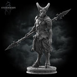 Grey resin digital render of the Satyr Spearman miniature — three-quarter front view highlighting the chest armour detail, rope-wrapped pauldron, claw-adorned belt, and the barbed spear tip raised to the right, with cloven hooves planted on a detailed cobblestone base