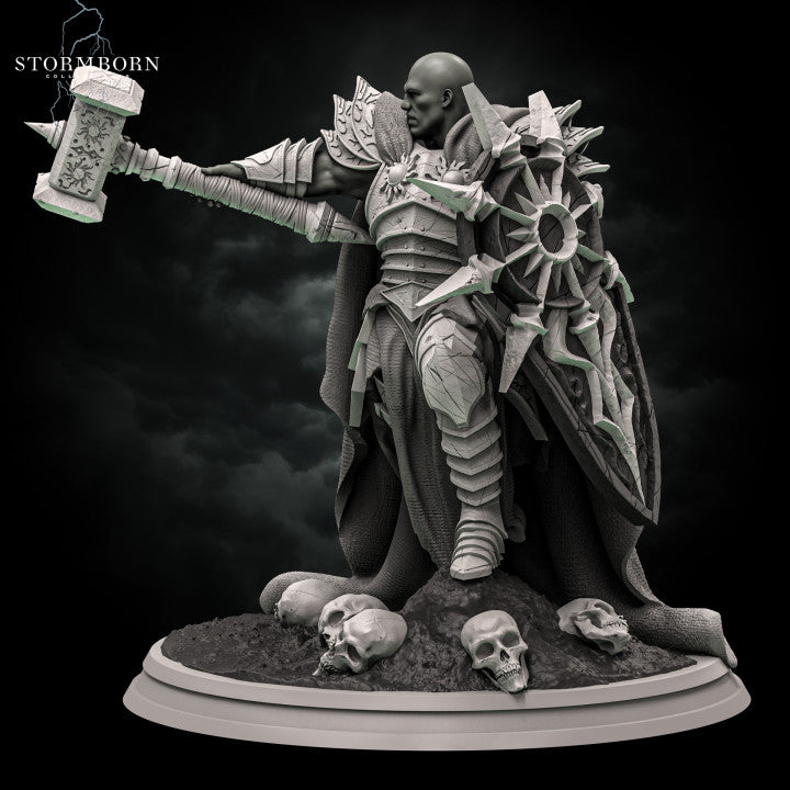 Three-quarter front angle of a bald warrior in sun-emblazoned armour raising an ornate warhammer overhead, large spiked shield at his side, skulls and rubble at his feet. Sculpt by Stormborn Collectibles.