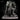 Bald broad-shouldered warrior in spiked plate armour thrusting a floral-relief warhammer forward, bearing a spiked sunburst shield, cloak billowing, standing over three skulls. Sculpt by Stormborn Collectibles.