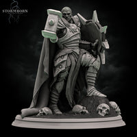 Bald broad-shouldered warrior in spiked plate armour thrusting a floral-relief warhammer forward, bearing a spiked sunburst shield, cloak billowing, standing over three skulls. Sculpt by Stormborn Collectibles.