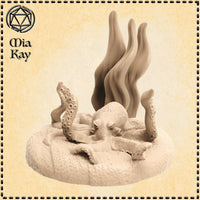 Unpainted cream resin miniature of an octopus in action pose, tentacles raised and curling outward from a textured sandy sea-floor base with tall kelp fronds rising behind it, sculpted by Mia Kay M3DM at 32mm scale