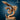 Digital render of the Quetzalcoatl miniature by La Louve 3D — an unpainted resin-gold feathered serpent coiling upward on an oval base, wings spread wide at the top, detailed scales covering the full body and layered feathers along the spine and wings, head turned to the side with a focused expression, displayed against a dark blue background