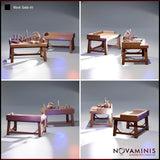 Four-angle digital render of the Novaminis Work Table 01 terrain set showing the cluttered alchemist's table from multiple viewpoints alongside the bare trestle table, highlighting the detailed wood grain, scattered bottles, mortar and pestle, open book, quill pen, and scroll across all perspectives