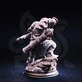Rear three-quarter view of the unpainted grey resin Achtum of the Meadow miniature, showing his bolt case, draped cloak with geometric patterning, back armour detail, and the sculpted naturalistic base — highlighting the DM Stash sculpt quality at 32mm scale