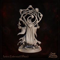 Rear view of a horned draconic figure in a billowing tattered robe, arms slightly raised, with a sweeping skull-and-bone orrery canopy fanning outward above the head. Rocky crystal debris visible across the base. Sculpt by Great Grimoire.