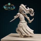 Rear view of an armoured female rogue, long hair streaming behind her, a longsword extended to the left, a curved short blade raised in her right hand, belted coat flowing mid-stride, detail visible on greaves and back pouches. Sculpt by DnD Is A Woman.