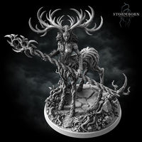 Aldara by Stormborn Collectibles — bark-and-vine humanoid figure leaning forward with thorned staff extended, antlered crown prominent, wild hair blending into organic body, scenic root-covered base.