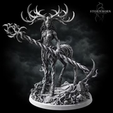 Aldara by Stormborn Collectibles — antlered fey figure formed from twisted bark and roots, holding a thorned staff outward, standing on a detailed base of exposed roots and cracked stone.