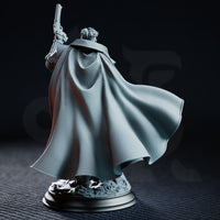 Male investigator figure in layered armour and a long coat with skull-decorated pauldrons and belt, holding a flintlock aloft, on a debris-covered scenic base. Sculpt by DM Stash.