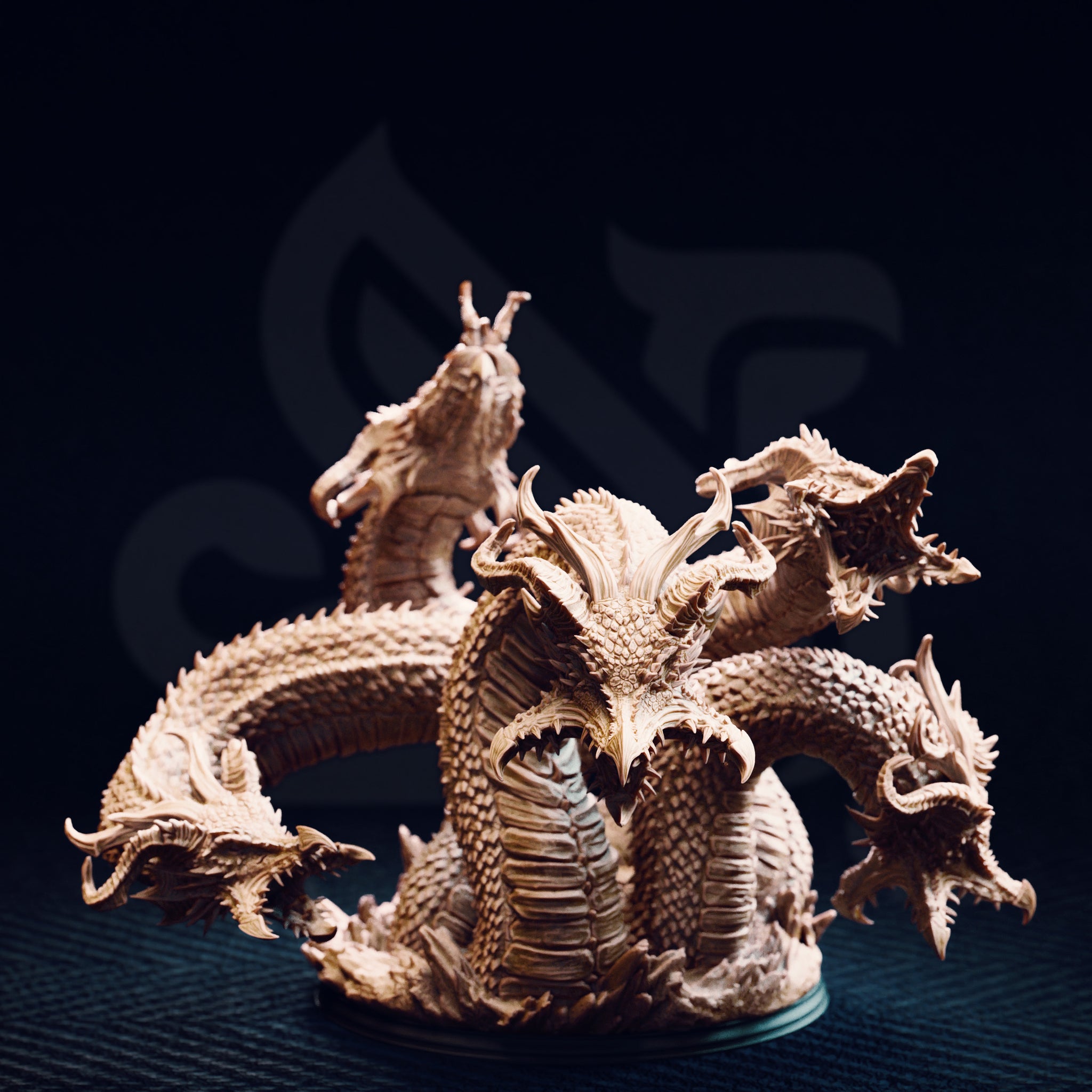 Unpainted resin miniature of Algaira the five-headed desert hydra, front view — showing five distinct serpentine necks rising from a coiled scaled body, with detailed overlapping scale plates, barbed horns, and open jaws, mounted on a round base