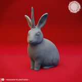 Close-up digital render of the jackalope miniature variant — a seated rabbit with small antler-like horns between its ears, unpainted grey sculpt, shown in detail against a red background by Yasashii Kyojin Studio