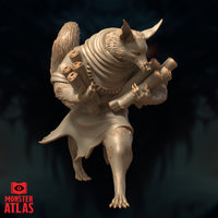 Front-facing view of the Arcanaloth unpainted resin miniature by Monster Atlas, showing the horned fox head lowered attentively, the rolled scrolls bundled tightly in its clawed arms, and the textured fur detail across the body contrasting with the smooth fabric of the cloak