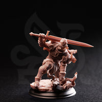Front view of an unpainted resin miniature of an animated suit of armour charging forward, sword raised overhead in both gauntleted hands, wearing ornate plated armour with a billowing tattered cloak, mounted on a scenic base of cracked flagstones — 32mm scale tabletop miniature for D&D