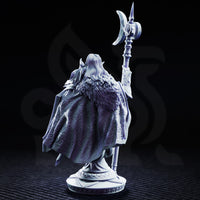 Rear view of the dark elf knight bust showing a sweeping cloak covered in deeply sculpted swirling scrollwork relief patterns, fur trim at the shoulders, crescent halberd raised in one hand. Sculpt by DM Stash.
