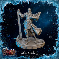 Front view of Atlas Starling unpainted grey resin miniature — bearded male wizard holding an open spellbook in one hand and raising a tall rune-covered scroll in the other, wearing a billowing cloak over layered robes with a star amulet, standing on a sculpted arcane circle base