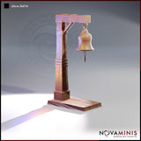 Digital render of Alarm Bell 01 scatter terrain by Novaminis — an L-shaped gallows-style wooden bell post with iron-banded joints, a hanging bell suspended by a chain with a clapper rope, mounted on a flat rectangular wooden base. Shown unpainted in warm pre-visualisation tones.