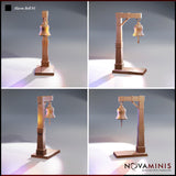 Four-panel digital render showing multiple angle views and design variants of the Novaminis Alarm Bell 01 scatter terrain piece — featuring arch-frame and L-post variants of a medieval wooden alarm bell with hanging bell, chain, and clapper. All shown unpainted in pre-visualisation render tones.