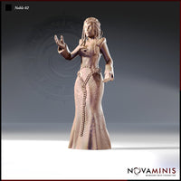 32mm scale resin miniature render of Noble 02 by Novaminis — an elegant female noble in an intricately embossed gown with a heavy chain belt and long beaded braids, arms raised in an open expressive gesture