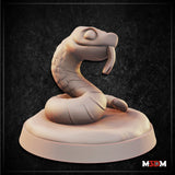 Digital render of a Baby Hognose Snake miniature by Mia Kay M3DM — a small serpent rearing up in a tight coil on an oval base, head raised with a distinctive upturned snout and forked tongue, showing broad scale detail across the neck and body, shown in unpainted cream resin against a dark textured background