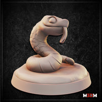 Digital render of a Baby Hognose Snake miniature by Mia Kay M3DM — a small serpent rearing up in a tight coil on an oval base, head raised with a distinctive upturned snout and forked tongue, showing broad scale detail across the neck and body, shown in unpainted cream resin against a dark textured background