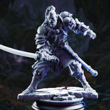 Rear view of an orc blademaster showing intricately rope-lashed lamellar back armour, long braided topknot, and a wide layered skirt with diamond-cut surface texture. Curved blade extended to one side. Cracked stone base. Sculpt by DM Stash.