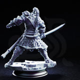 Orc warrior in rope-bound samurai-style armour gripping a curved sword at waist height, knees bent and weight low as if reading an opponent's movement. Skull mounted on pauldron, hexagonal-patterned fabric skirt. Sculpt by DM Stash.