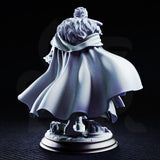 Male sorcerer in a long belted coat, holding a fractured arcane focus staff low at his side, curly hair, determined expression, on a round scenic base with broken stonework. Sculpt by DM Stash.