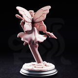 Battle Bell Fairy Knight by DM Stash — winged fairy warrior in floral armour posed mid-leap, wielding a barbed blossom lance and carrying a round shield, flower crown on her head, in pink resin.