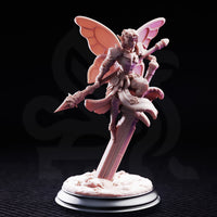 Battle Bell Fairy Knight by DM Stash — close view of the full miniature on a plain display base, showing segmented butterfly wings, trim floral armour, dynamic raised-leg pose, and barbed lance angled forward.
