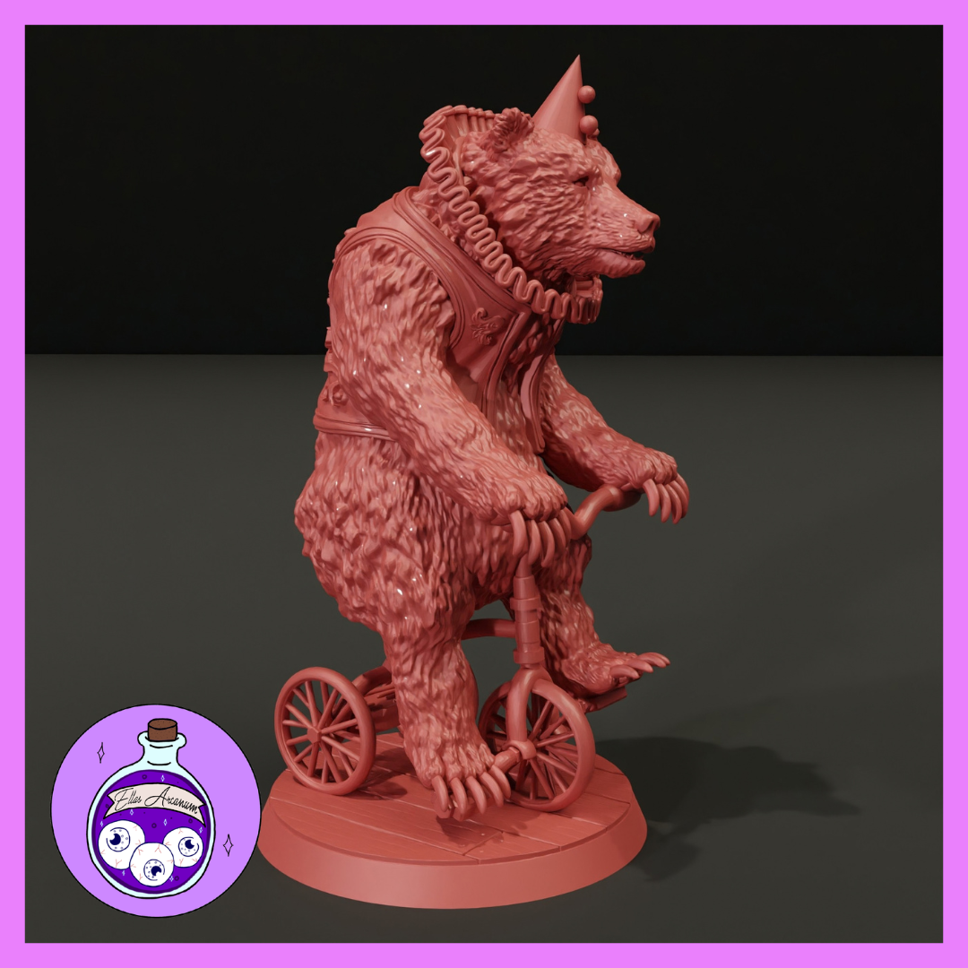 A large shaggy bear wearing a conical party hat and frilled neck ruff, gripping the handlebars of a tiny two-wheeled bicycle with clawed paws, seated upright on a detailed circular base. Sculpt by Ella's Arcanum Minis.