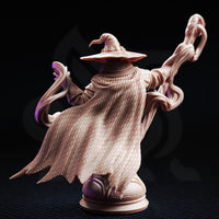 Rear three-quarter view of Big Hat Harrison bust showing the finely textured woven cloth robes, buckled belt detail, and the sweeping magical energy tendrils curving outward from the figure, mounted on a decorated column plinth