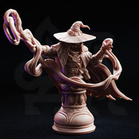 Front three-quarter view of Big Hat Harrison bust highlighting the looping arcane energy coils around both arms, the shadowed face beneath the wide wizard hat, and the intricate arcane motif detailing on the ornamental display plinth