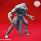 Three-quarter view render of a Blemmye miniature mid-lunge — torso low, one arm sweeping forward, fanged chest-face snarling, bare clawed feet, unpainted grey resin, 32mm scale by Yasashii Kyojin Studios