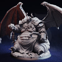 Front view of unpainted grey resin Bodge the Ravenous miniature showing full detail of his horned helm, layered chest armour, bloated robed torso, clawed hands, and outstretched bat-like wings on a rubble-strewn round base