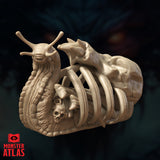 Digital render of the Bone Whelk miniature from Monster Atlas, shown at a three-quarter front angle. The creature is an undead snail with heavily textured slug-flesh body, two antennae, and a shell formed from interlocked ribs. A small skull sits inside the ribcage cavity and a skeletal form with clawed limbs crests the top of the shell. Unpainted tan render.