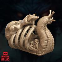 Digital render of the Bone Whelk miniature from Monster Atlas, shown from a three-quarter rear angle emphasising the slug body texture and the full ribcage shell structure. The nested skull inside the cage and the skeletal form atop the shell are clearly visible. Unpainted tan render.