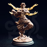 Front view of an unpainted 32mm resin miniature of Caryian the Monk of the Astral Sun, showing the crane-stance pose, flowing sash, scale-patterned trousers, and four spectral golden arms radiating outward, mounted on a detailed sandy textured base