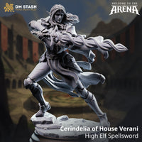 Promotional render of Cerindelia of House Verani High Elf Spellsword miniature from DM Stash's Welcome to the Arena collection, showing her mid-lunge pose with rune-etched blade extended, flowing coat, elven shoulder armour, and shattered stone base — unpainted grey resin