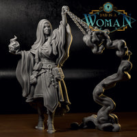 Grey resin print of Changeling Cleric Rin — long-haired cloaked figure with prayer beads at the belt, kindling sacred flame in one hand and swinging a heavy chain censer in the other, smoke column beside her.